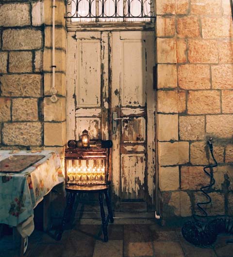 The chanukiah is placed in the doorway opposite the mezuzah